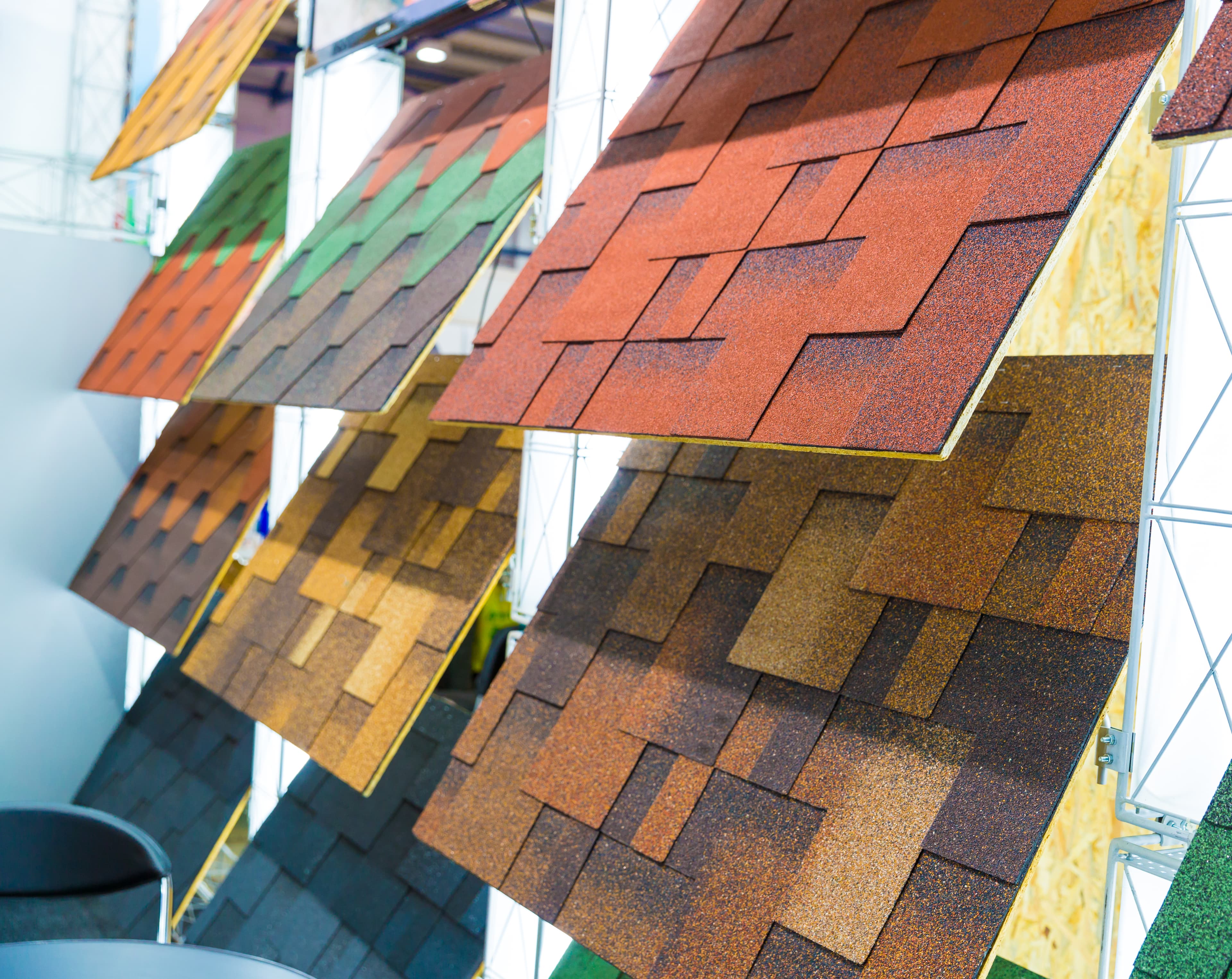 Roofing material samples — asphalt shingles, metal panels, and slate.