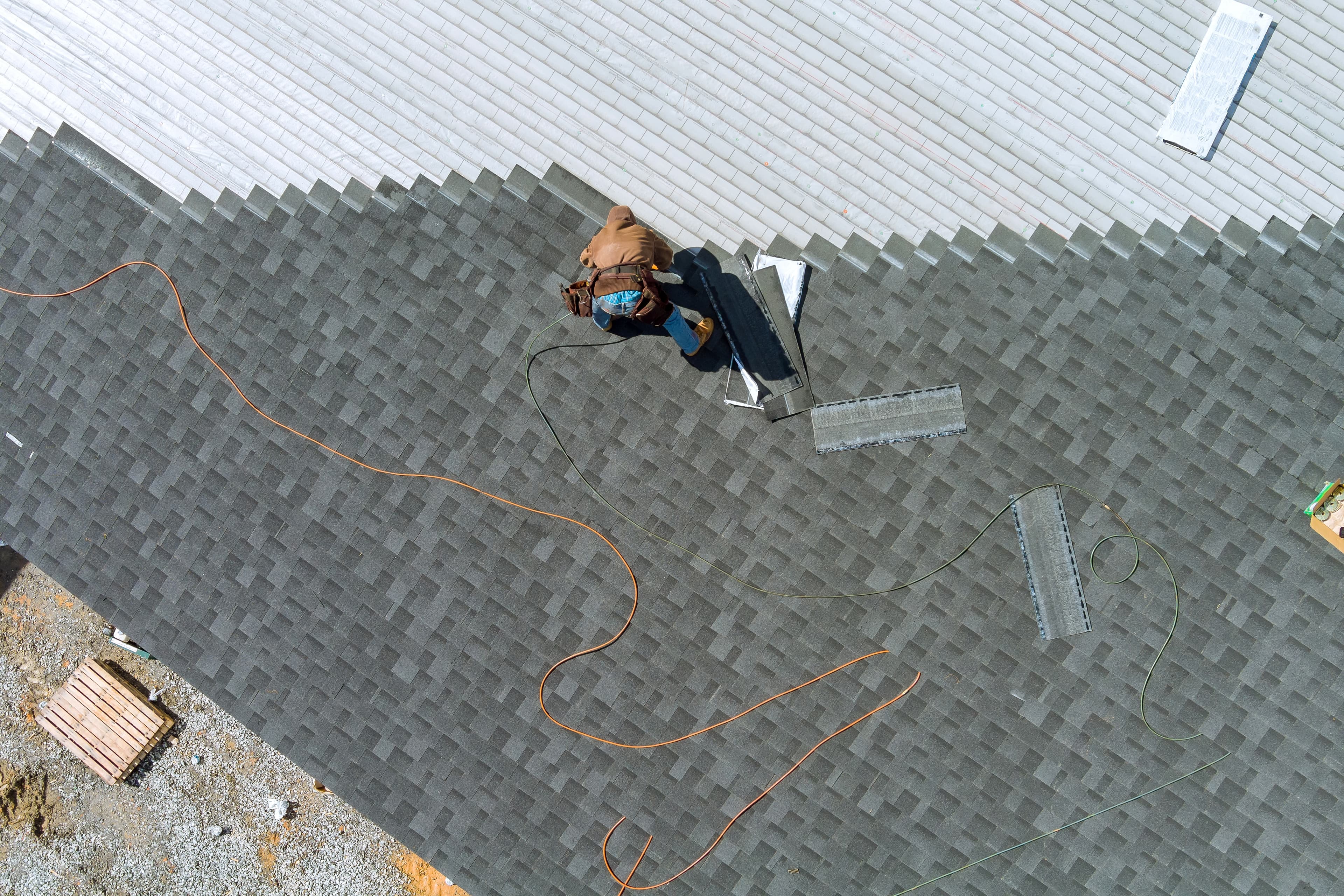 Roof showing damage and wear that informs the repair vs. replacement decision.