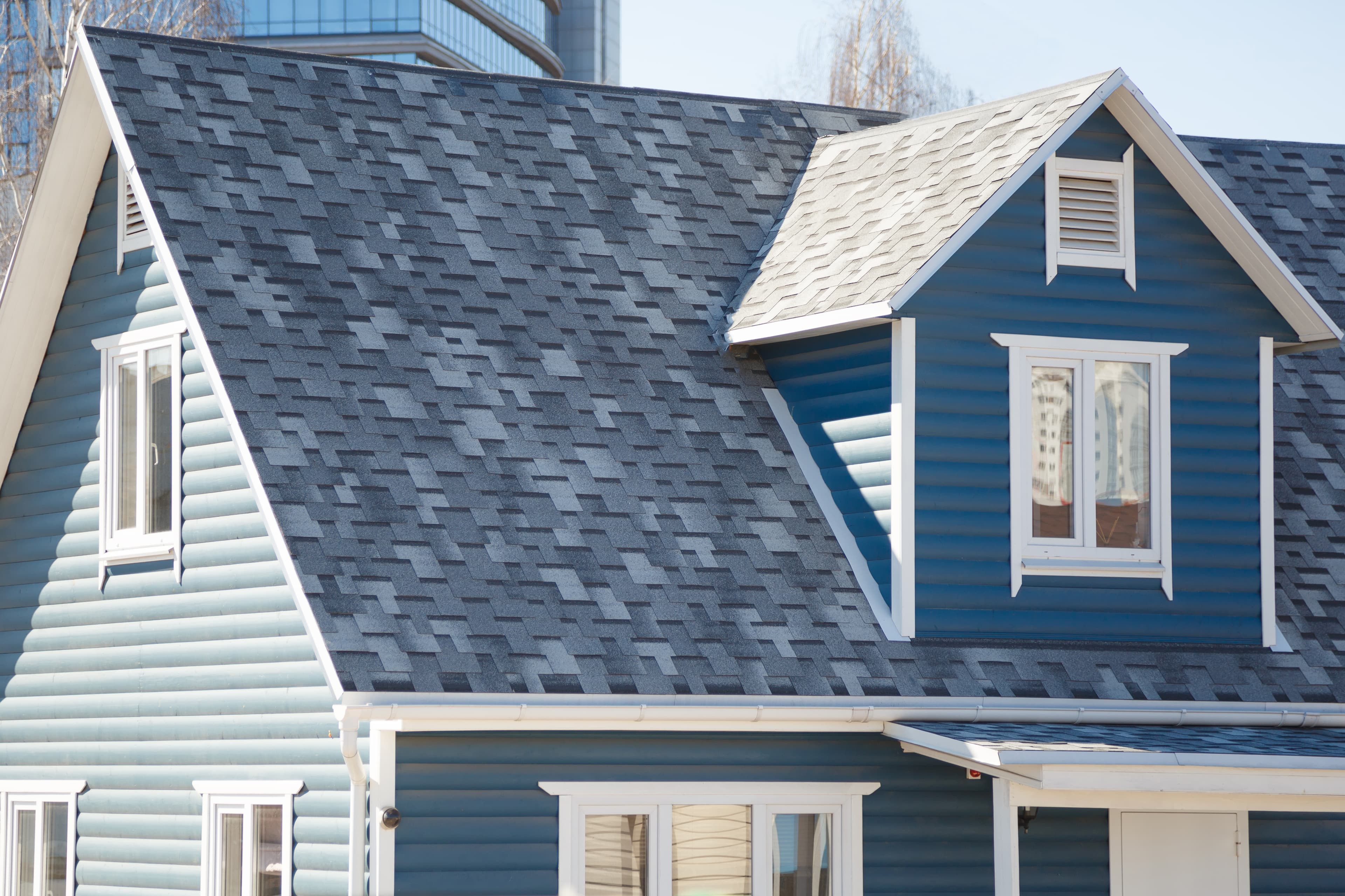 Residential St. Louis home with newly installed asphalt shingle roof.
